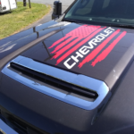 Flag design with "Chevrolet" text in cut vinyl. Cevrolet hood decal